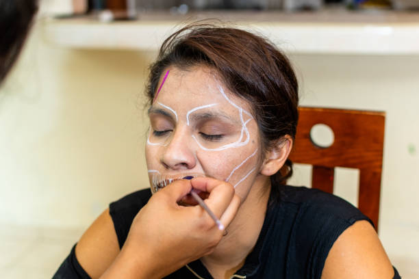 istock woman putting makeup on another woman 1278501196