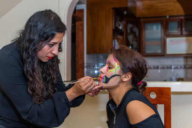 istock woman putting makeup on another woman 1278503097