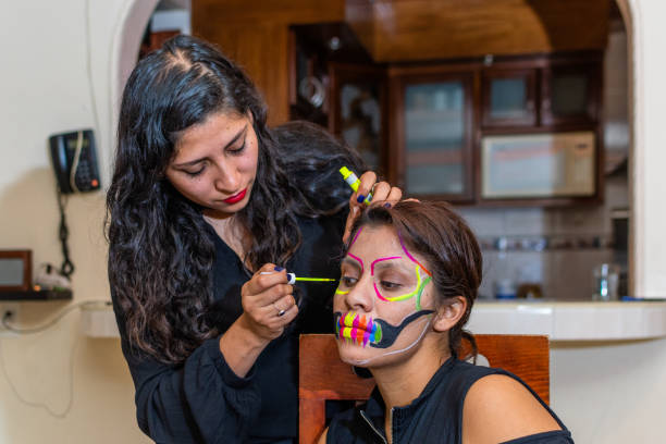 istock woman putting makeup on another woman 1278503267