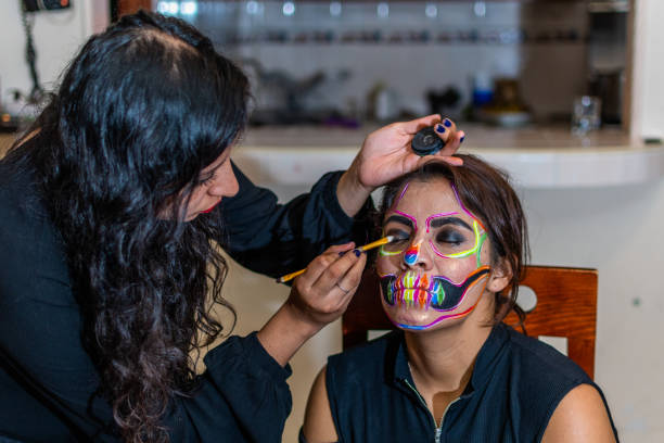 istock woman putting makeup on another woman 1278504129