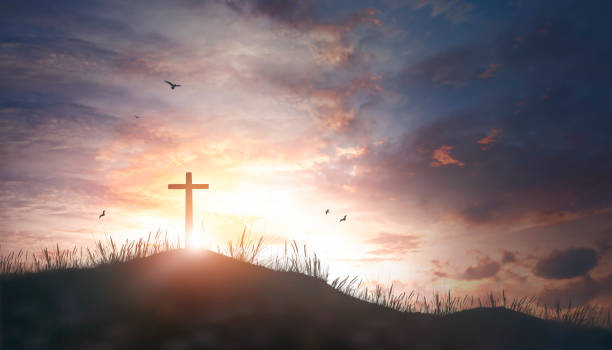 istock Thanksgiving concept: Religious cross silhouette against a bight sunrise sky 1278504730
