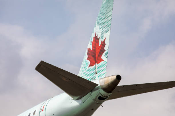 dramatic closeup of the traditional green color scheme tail of an air canada express embraer 170 landing at pearson international airport yyz - wheel airplane landing air vehicle imagens e fotografias de stock