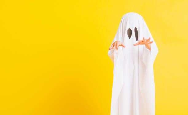 istock little cute child with white dressed costume halloween ghost scary 1278509355