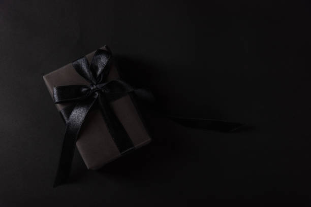 istock gift box wrapped in black paper and black bow ribbon 1278509402