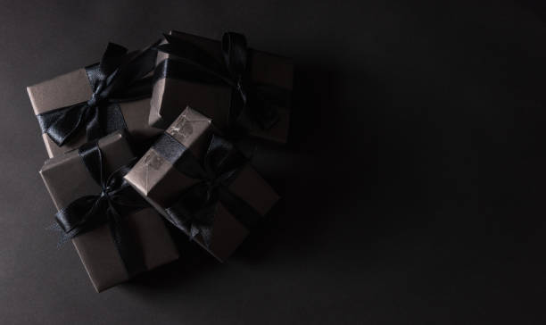 istock gift box wrapped in black paper and black bow ribbon 1278509407