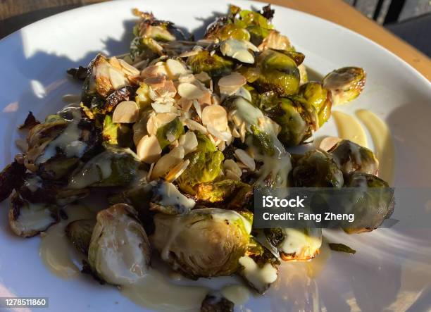 Close Up View Of Charred Brussels Sprouts With Almond Stock Photo - Download Image Now