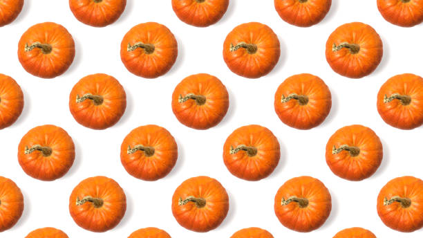 istock Seamless pattern of fresh orange pumpkins isolated on a white background. 1278512668