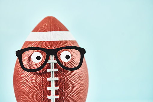 American Football With Funny Face Wearing Glasses