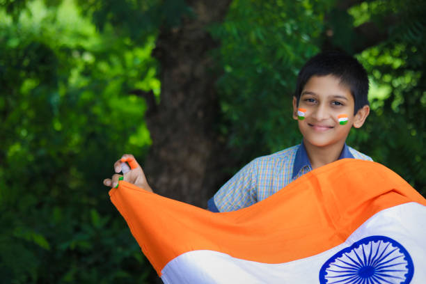 young indian child with indian flag on face