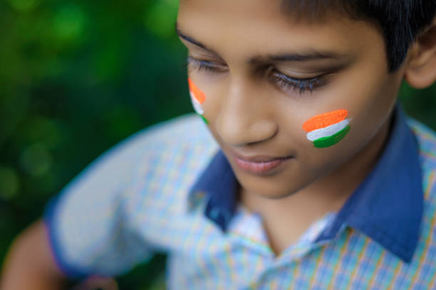 istock young indian child with indian flag on face 1278518224