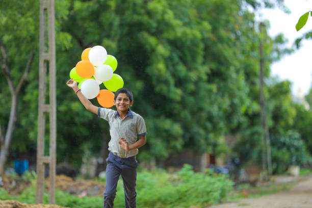 istock young indian child with tricolor balloon 1278518378