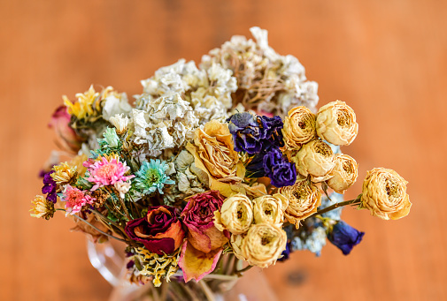 A bouquet of flowers made of dried flowers of various kinds.