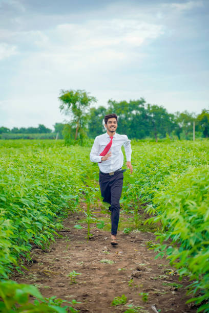 istock Young asian / Indian man running at agriculture field 1278519451