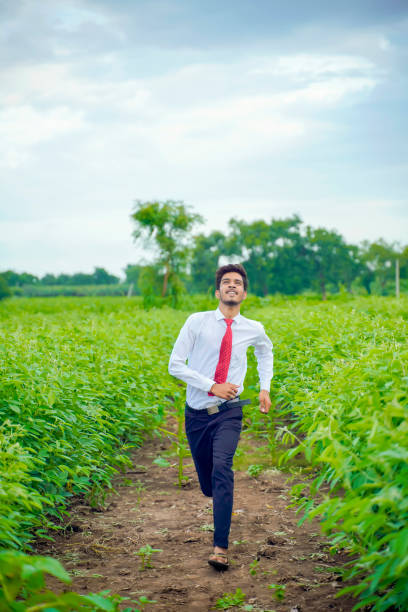 istock Young asian / Indian man running at agriculture field 1278519478