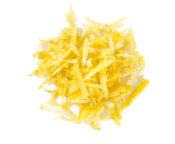 лимонная цедра изолирована на белом фоне - grater grated peel ingredient стоковые фото и изображения