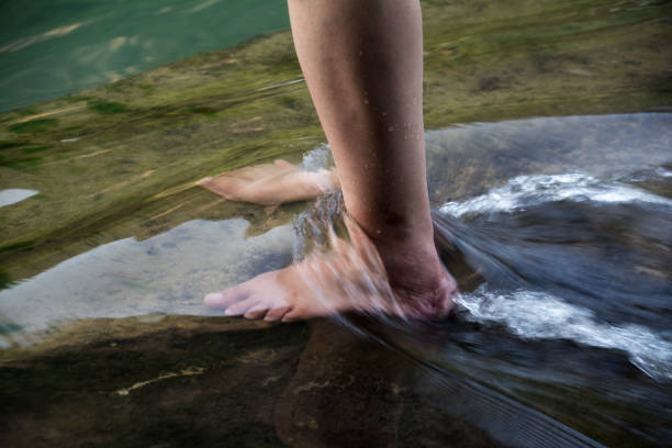istock Feet in River with Flowing Water 1278524593