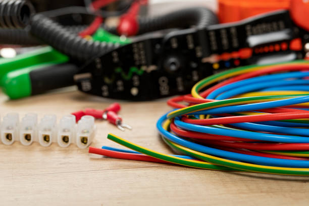 Electrical installations components Tools for electrician needs: voltage testers, wire strippers, pliers, cables, power cable stock pictures, royalty-free photos & images