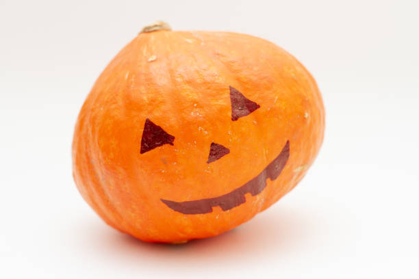istock Halloween pumpkin with smile face on white background 1278529501