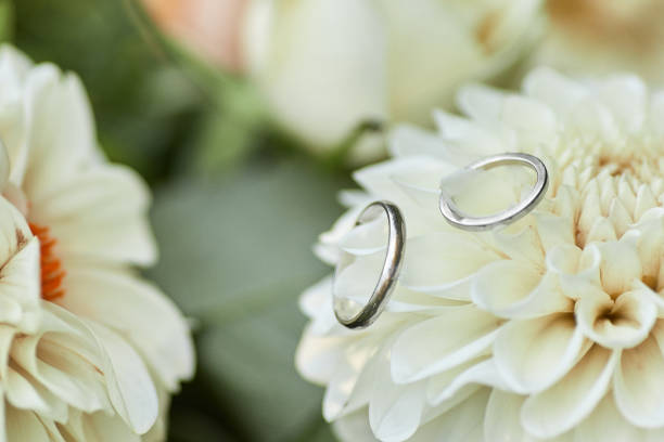 istock wedding rings and beautiful flower bouquet 1278534307