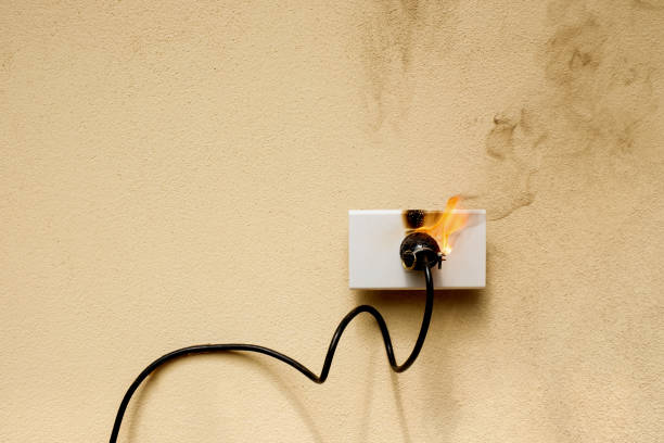 istock On fire electric wire plug Receptacle on the concrete wall background 1278535509