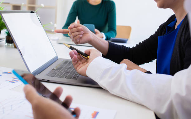 istock business team hands searching for data on mobile phone  with analyzing charts at his workplace. 1278535745