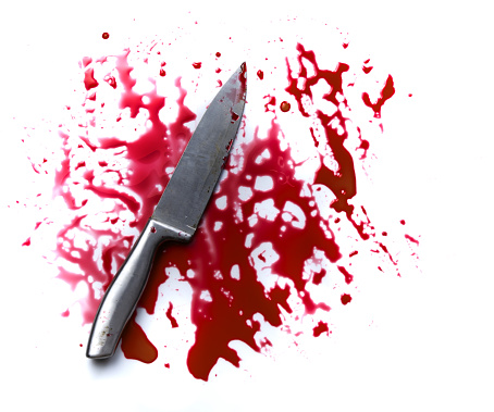 Concept Halloween night,bloody knife with blood splatter isolated on white