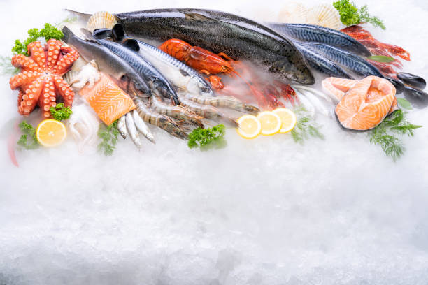 istock Top view fresh seafood on ice background with copyspae 1278536970