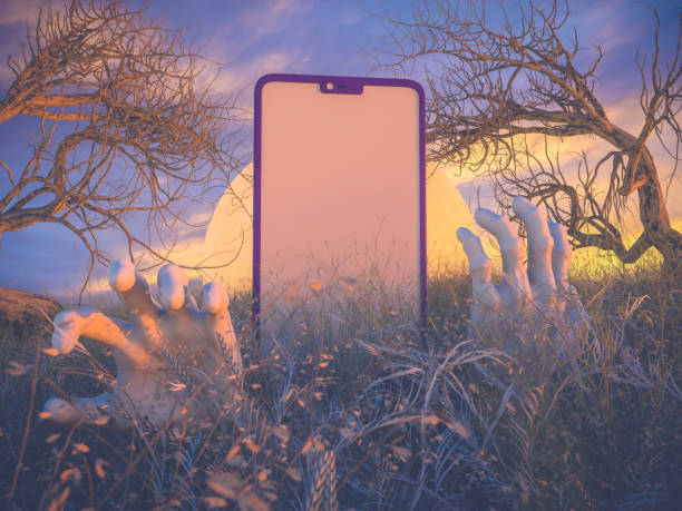Detailed close-up of a smartphone on the ground with a cracked screen.
