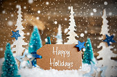 Christmas Trees, Snowflakes, Wooden Background, Label, Text Happy Holidays