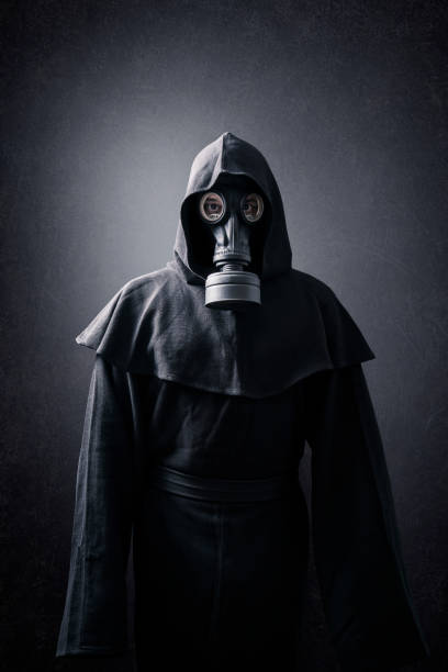 istock Man in a gas mask and hooded cloak. Environment pollution. 1278543441