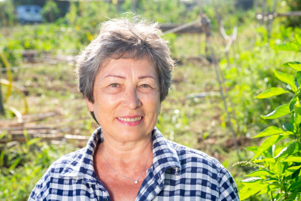 istock Cheerful aged woman ready to work in home garden 1278543648