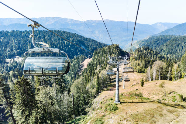 istock Ski lift with supports and chairs in mountains on summer 1278545522