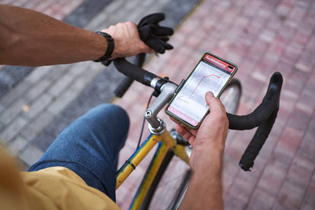 istock Male courier checking mobile app for direction in the city 1278547094