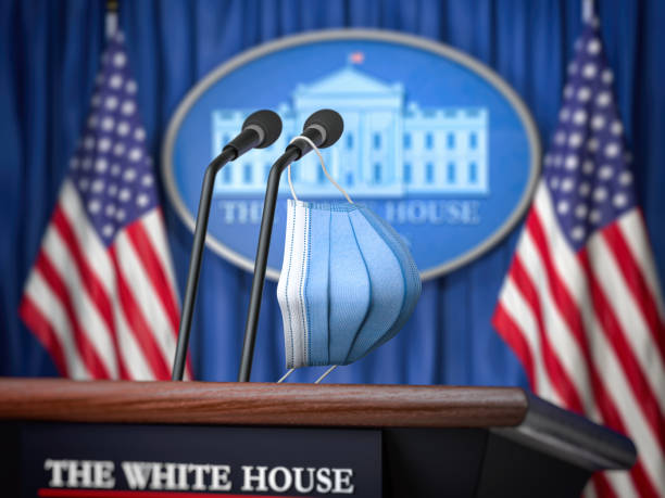 Mask on microphone in White House. Coronavirus COVID 19 of president of USA concept. Mask on microphone in White House. Coronavirus COVID 19 of president of USA concept. 3d illustration presidential election stock pictures, royalty-free photos & images