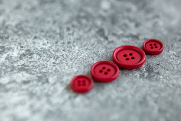 istock Pile matte buttons on concrete background, macro bokeh. beautiful needlework 1278550783