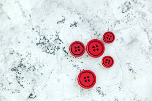 istock Pile matte buttons on concrete background, macro bokeh. beautiful needlework 1278550789