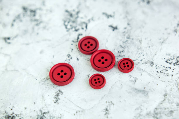 istock Pile matte buttons on concrete background, macro bokeh. beautiful needlework 1278550805