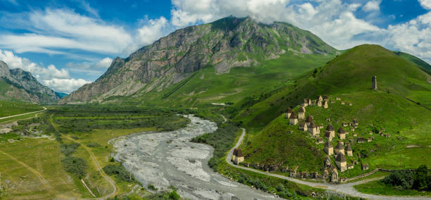 Dead Town Dargavs In North Ossetia Dead Town Dargavs In North Ossetia. The ancient cemetery of the Alans. Many small stone mausoleums, standing on the side of a mountain. north caucasus photos stock pictures, royalty-free photos & images