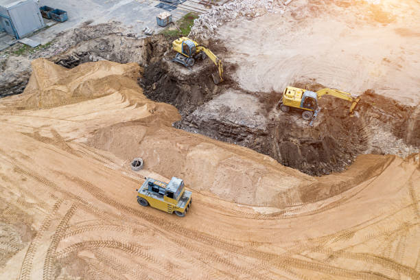 istock excavator prepares the site for construction of the view from the top. 1278555649
