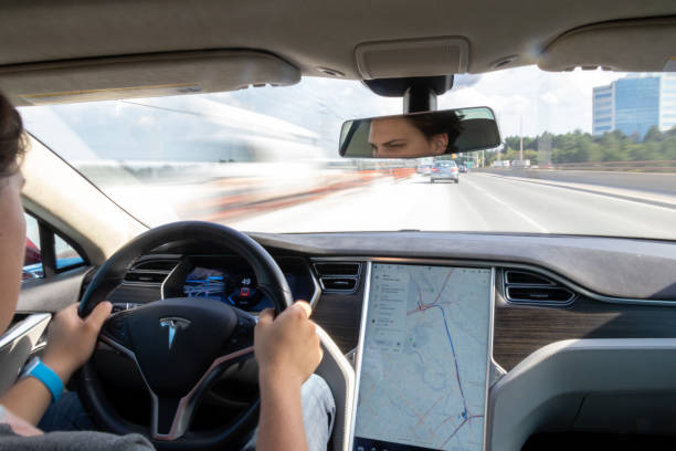 Driving a Tesla Model S on the Highway stock photo