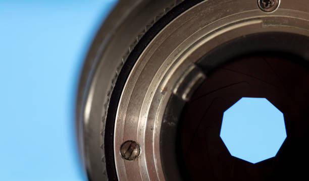 istock close-up. photography lens with shutter, blue background 1278559059