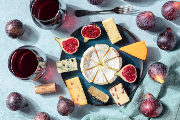 istock Cheese platter, shot from the top with wine and fresh fruit, a flat lay 1278559721