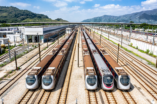 High angle aerial view of MTR Pat Heung Maintenance centre depot with train lines