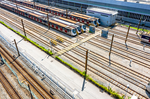High angle aerial view of MTR Pat Heung Maintenance centre depot with train lines