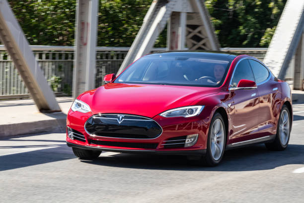 Tesla Electric Model S Driving on a Sunny Day stock photo