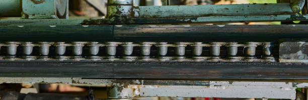 abstract, detailed view of the conveyor chain for tools on an old machine - rust metal imagens e fotografias de stock