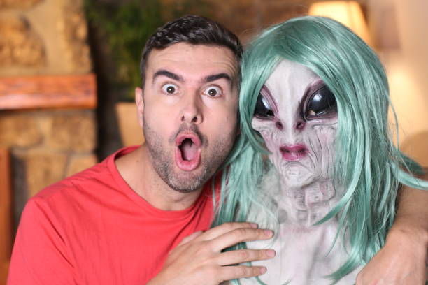 istock Man taking a picture with funny looking alien 1278561389