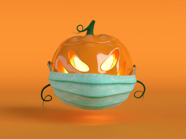 istock 3d render. Halloween pumpkin in protective medical mask on orange background 1278563345