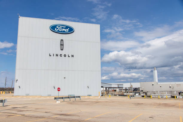 Ford and Lincoln Signs on top of Factory stock photo