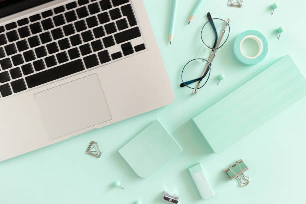 istock Composition with laptop, glasses and stationery on the mint table 1278564564